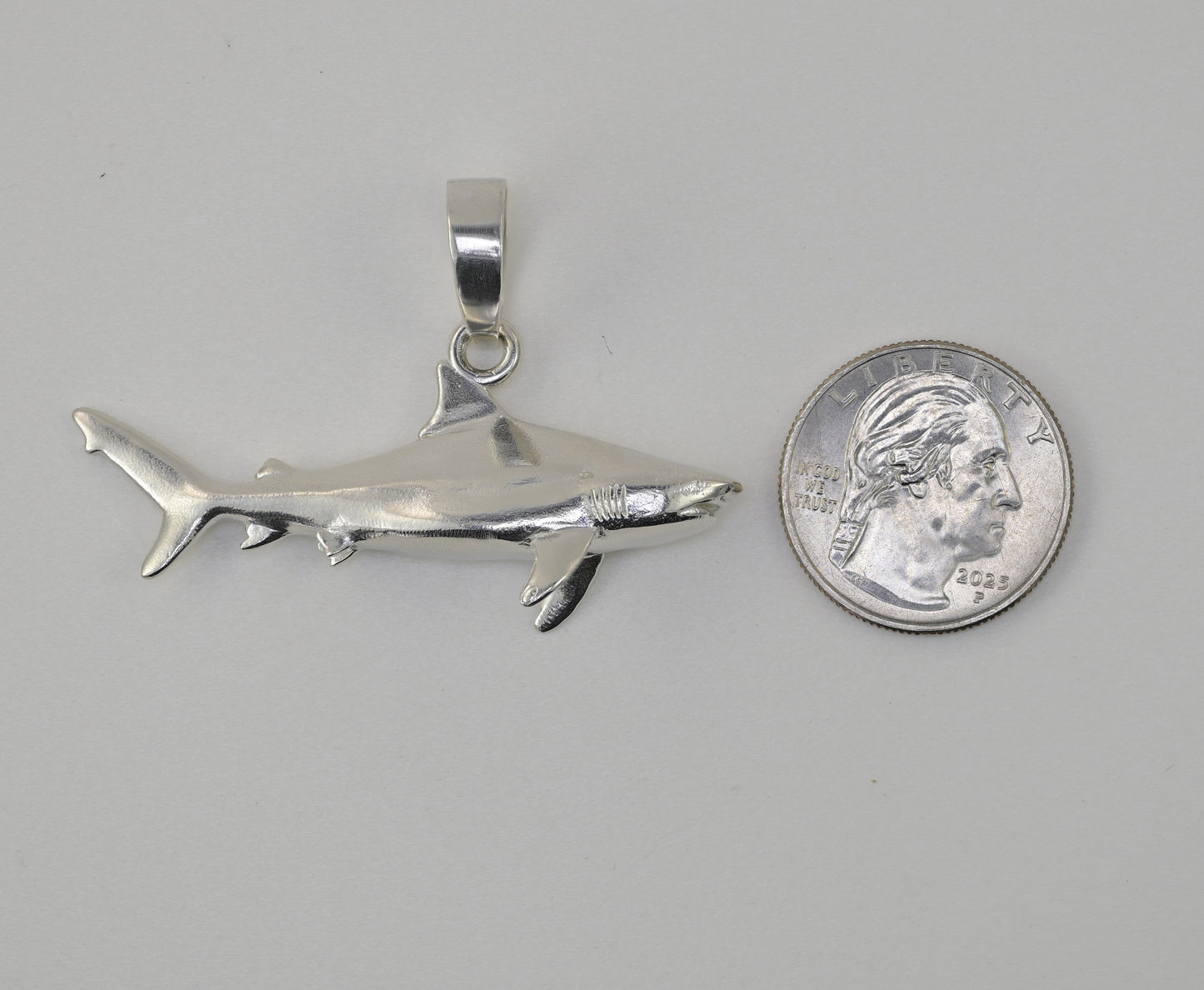 Bull shark made in sterling silver size reference compared to a quarter