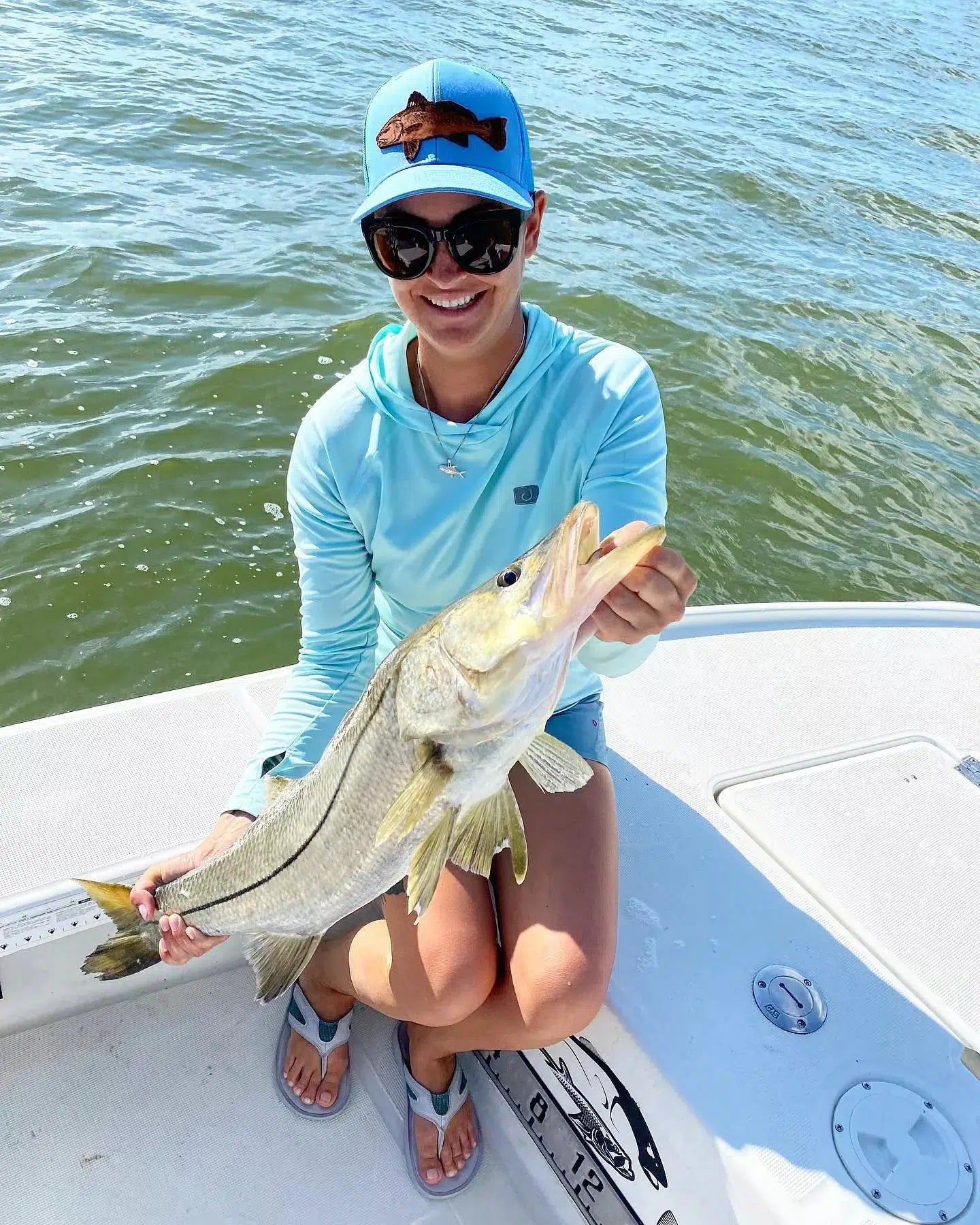 Permit Pendant - Small worn by customer that is holding a snook