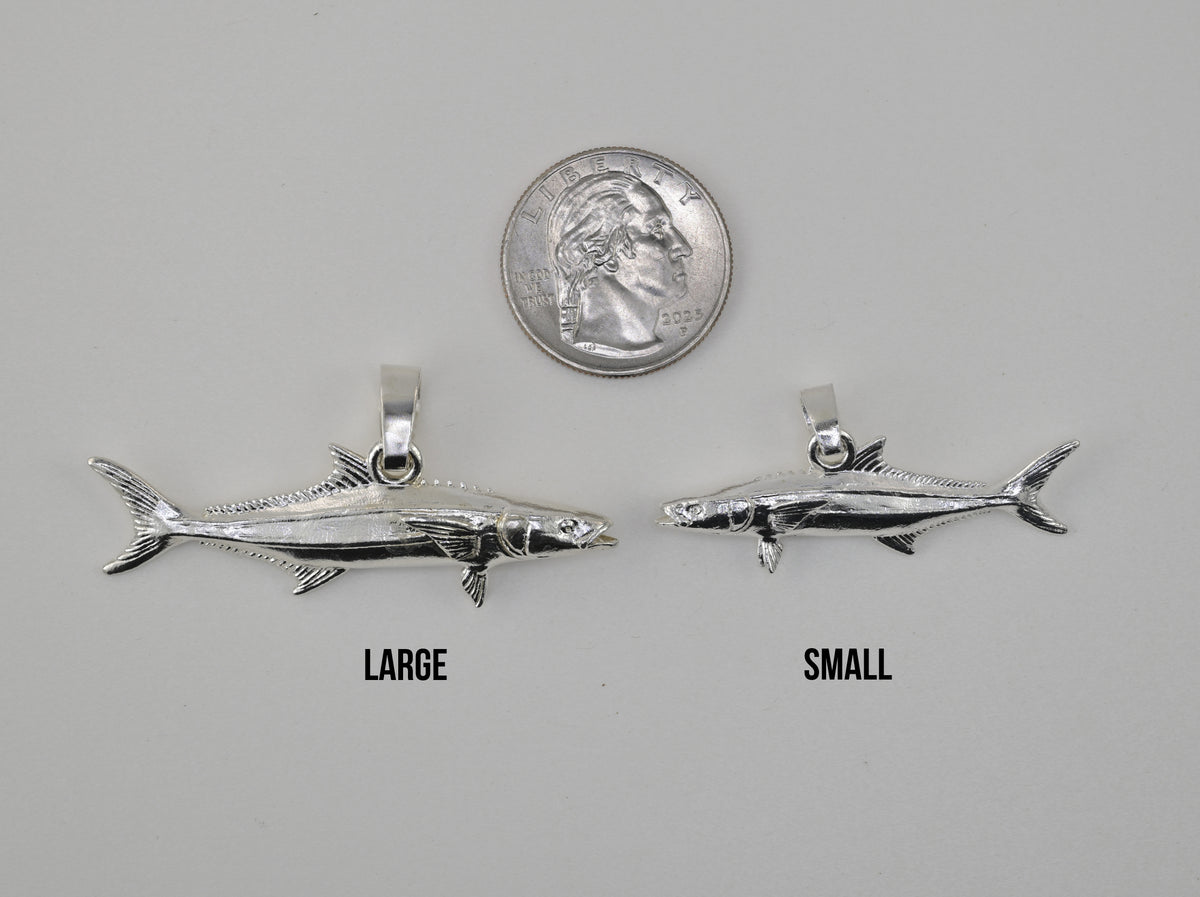 Cobia pendant small vs large size comparison next to a quarter 