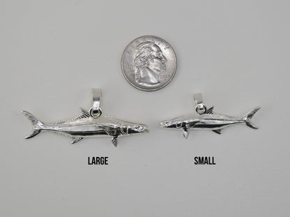 Cobia pendant small vs large size comparison next to a quarter 