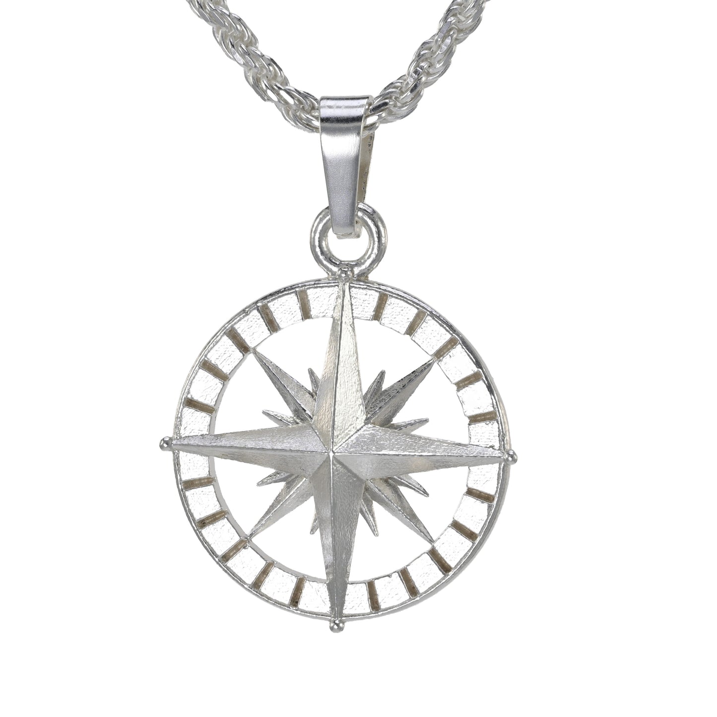 Medium sized compass rose in sterling silver shown on a rope necklace.