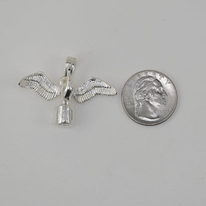 Cormorant pendant in sterling silver size reference next to a quarter