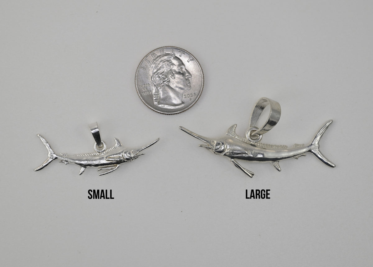 marlin pendant large vs small size reference next to a quarter