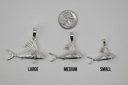 The Large Medium and Small Roosterfish next to each other and next to a quarter for size reference