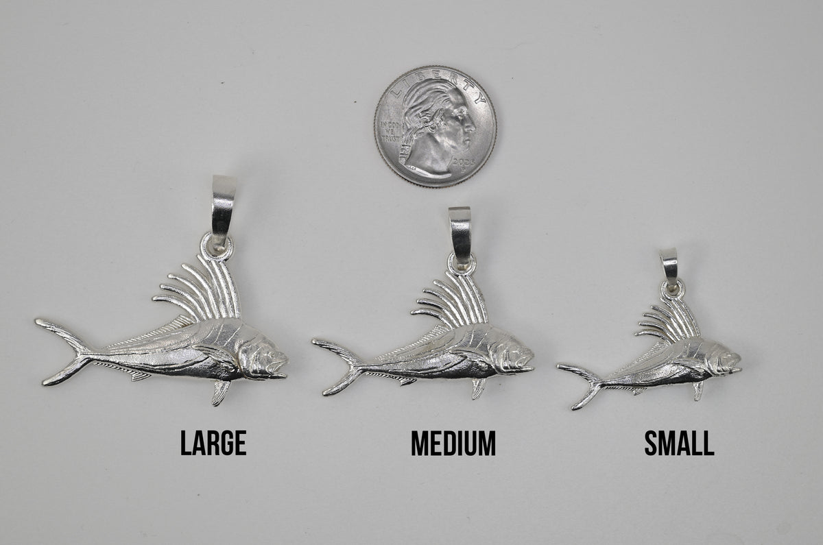 The Large Medium and Small Roosterfish next to each other and next to a quarter for size reference