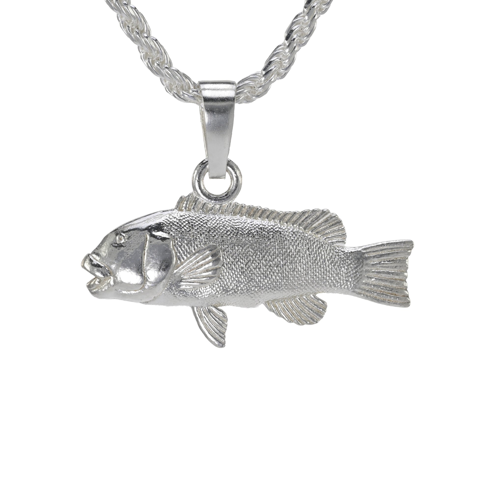 Silver  tautog fish pendant on a white background