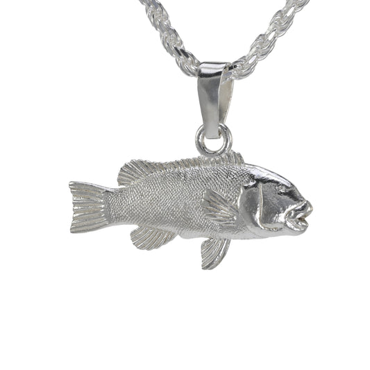 Silver  tautog fish pendant on a white background