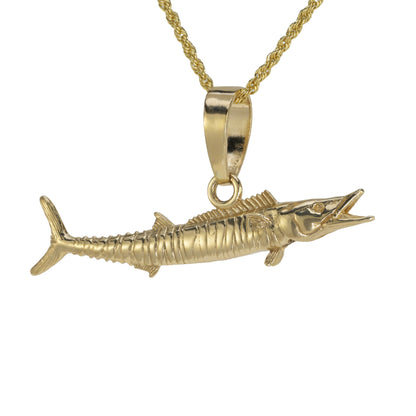 Gold Wahoo fish pendant on a gold chain against a white background