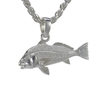 Large black drum pendant facing left in sterling silver double sided